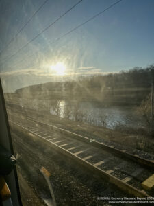 a train tracks next to a body of water