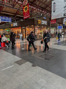 people walking in a train station