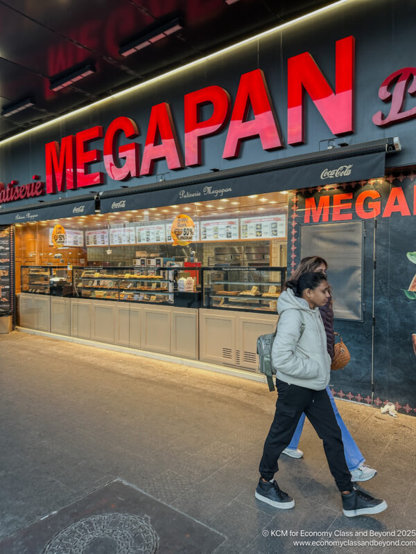 a woman walking past a store