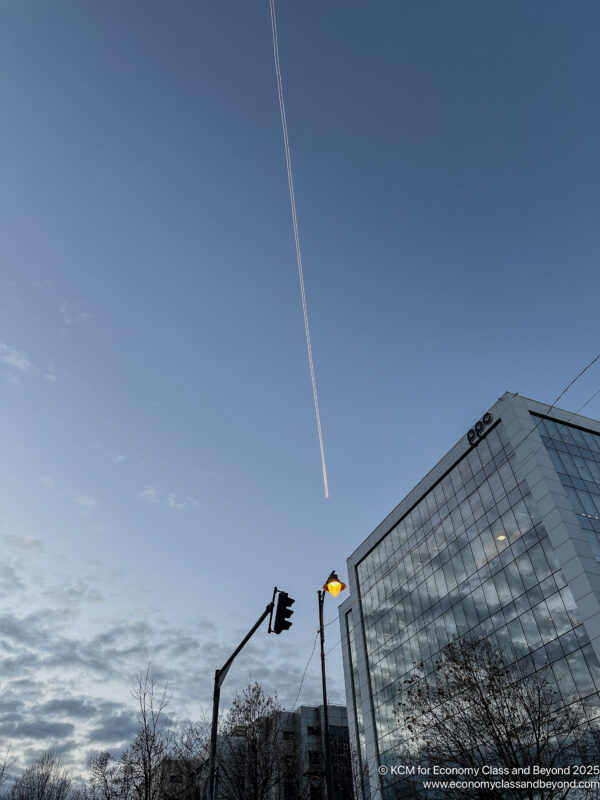 a plane flying over a building