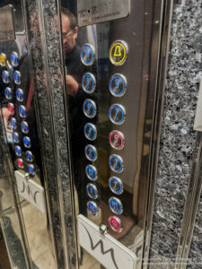 a close up of buttons on a elevator