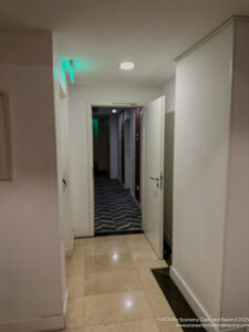 a hallway with a door open