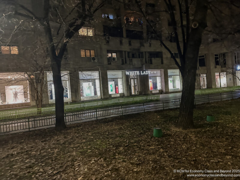 a building with many windows and trees