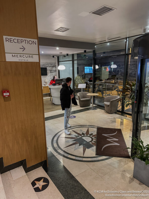 a man standing in a lobby