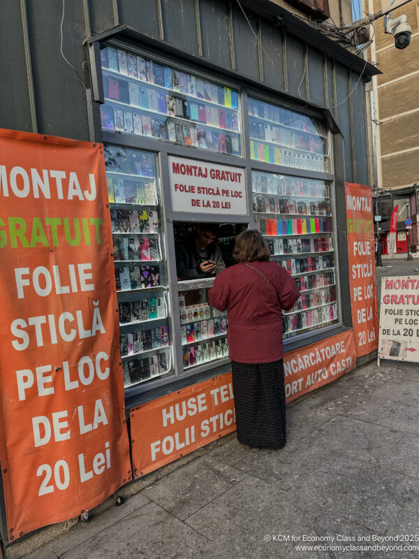 a woman standing in front of a store