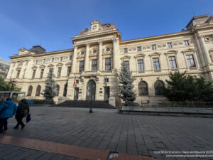 a large building with a stone walkway