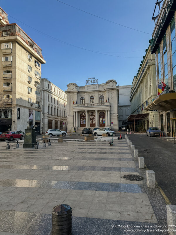 a street with cars and buildings