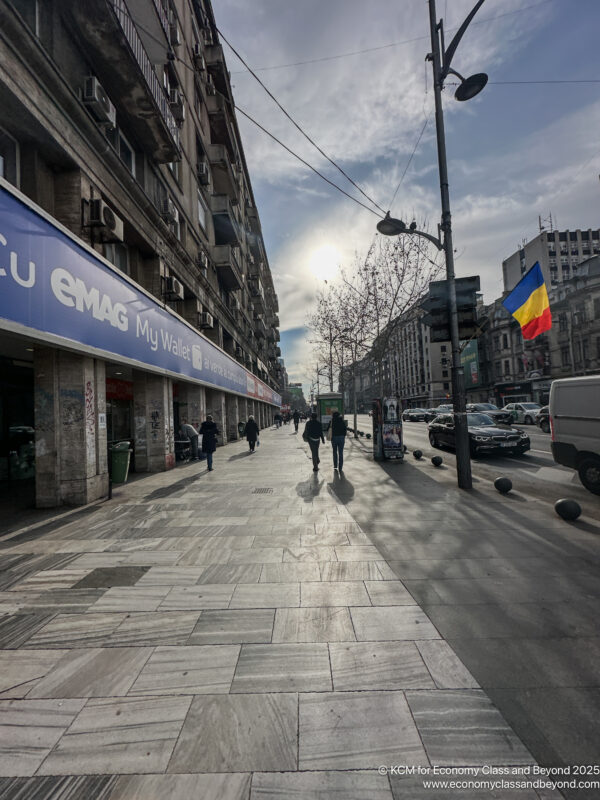 people walking on a sidewalk