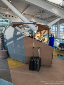 people standing in a room with luggage