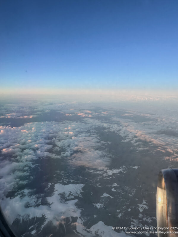 an aerial view of clouds and a blue sky