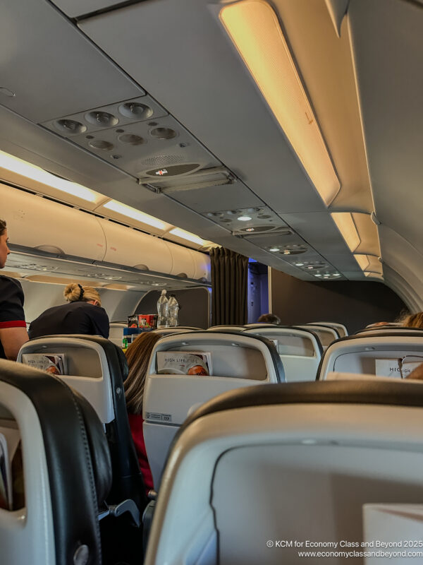 a group of people sitting in an airplane