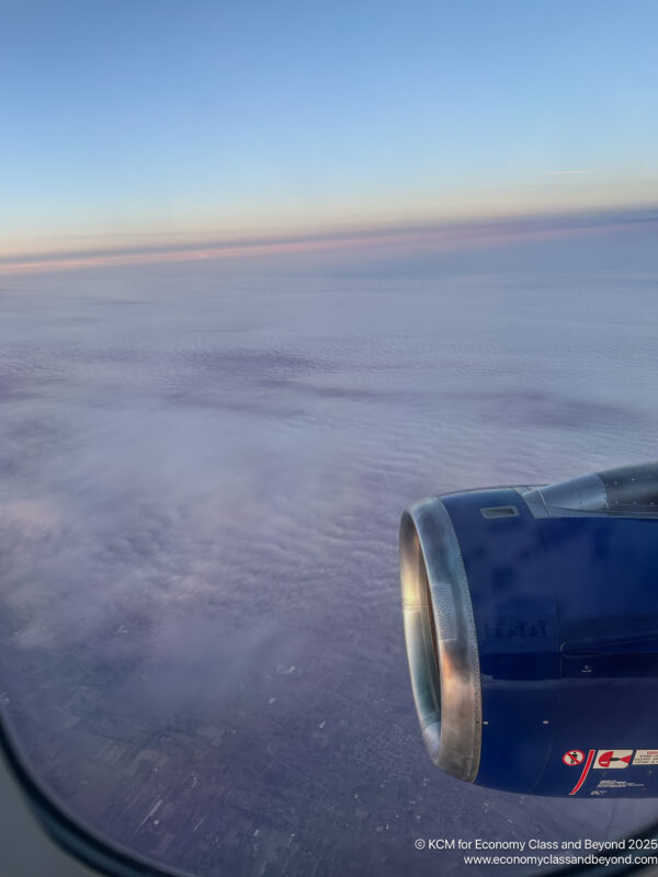 an airplane wing and the sky