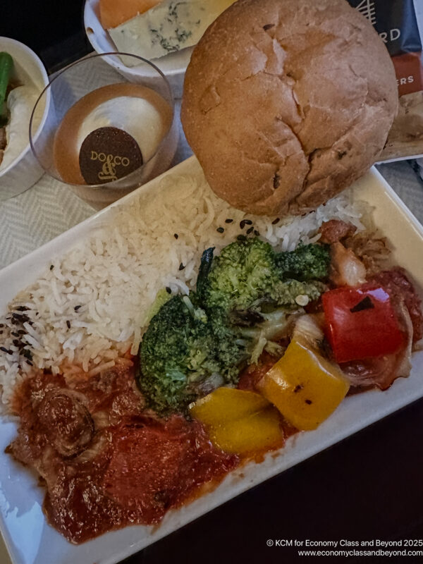 a plate of food with a roll