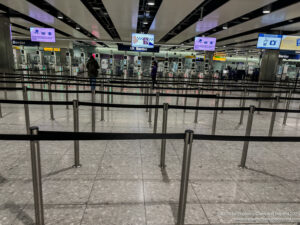 a group of people standing in a line at an airport