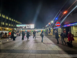 people walking on a sidewalk