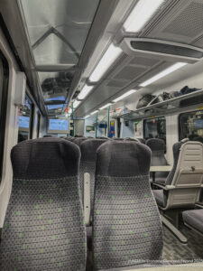 a train with seats and a table