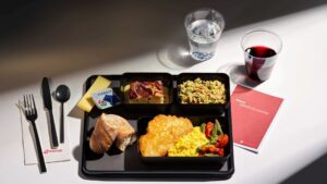 a tray of food and a glass of water