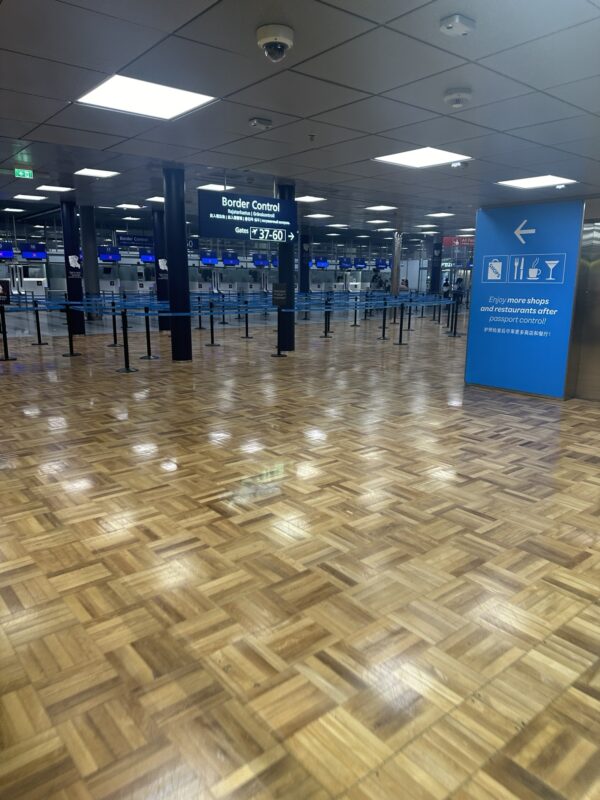 a wooden floor with blue signs and blue ropes