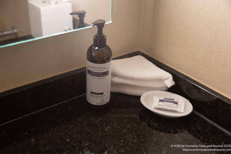 a soap dispenser and a towel on a counter