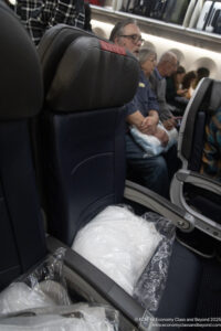 a group of people sitting in an airplane