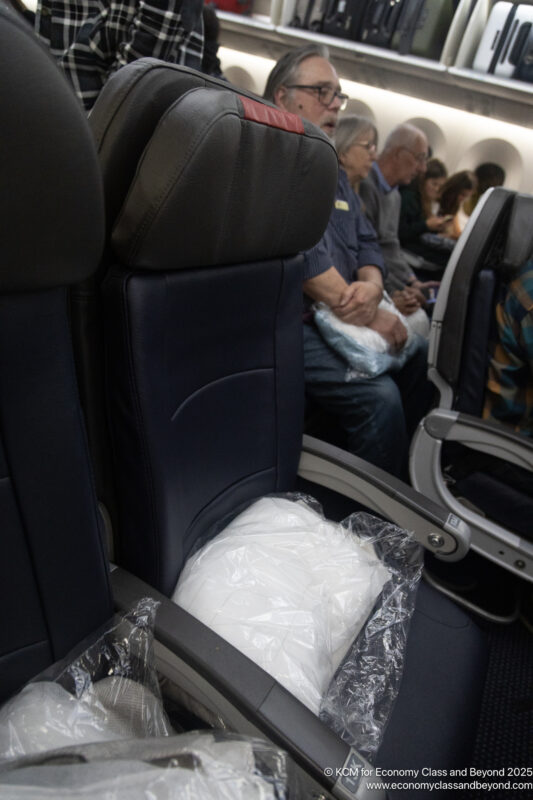 a group of people sitting in an airplane