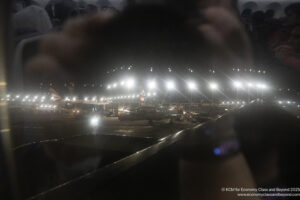a view of an airport from a window at night