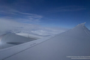 a wing of an airplane in the sky