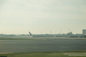 an airport with an airplane on the runway