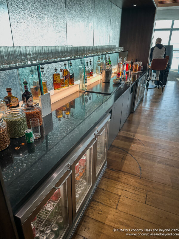 a bar with bottles of liquor and glasses