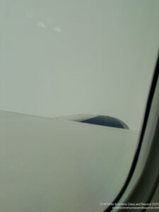 a plane wing in the sky