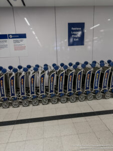 a row of luggage carts in a row