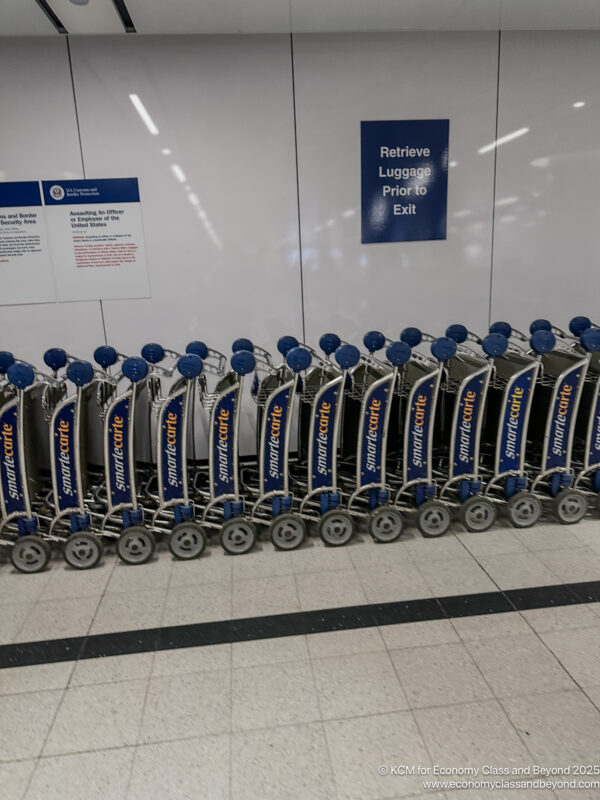 a row of luggage carts in a row
