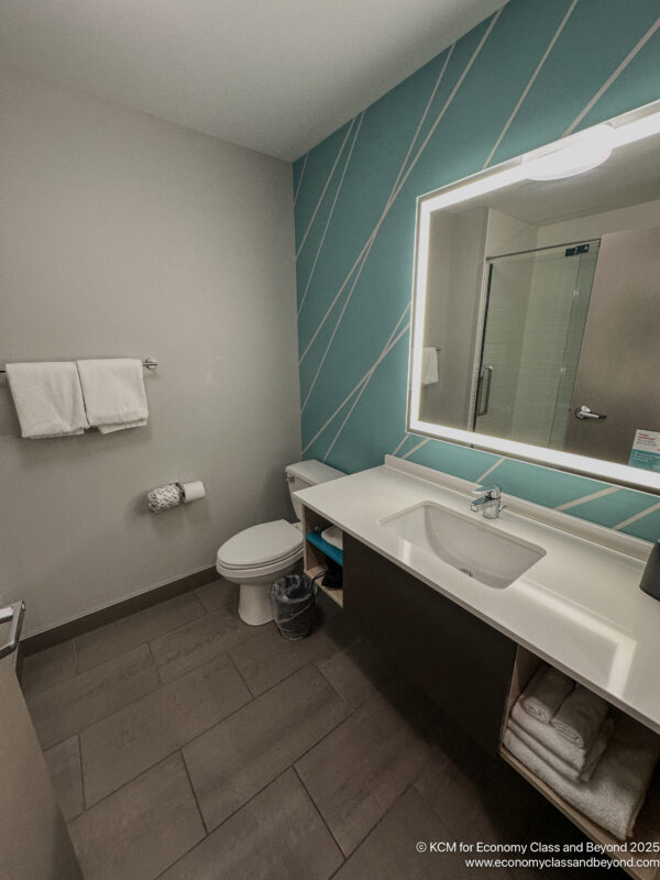 a bathroom with a mirror and sink
