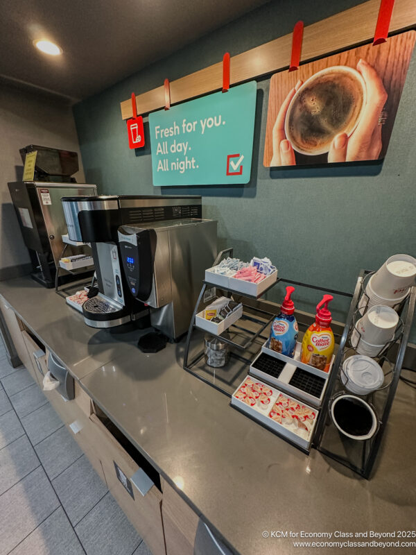 a coffee machine and coffee cups on a counter
