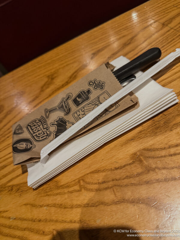 a napkins and a knife on a table