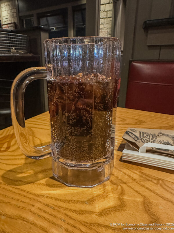 a glass of liquid on a table