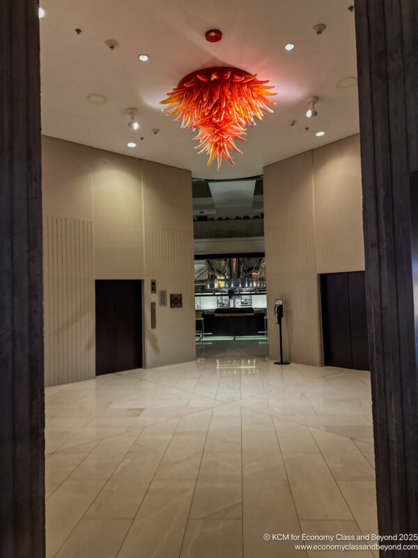 a glass chandelier in a lobby