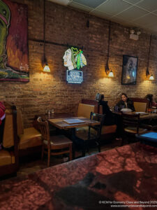 a group of people sitting at tables in a restaurant
