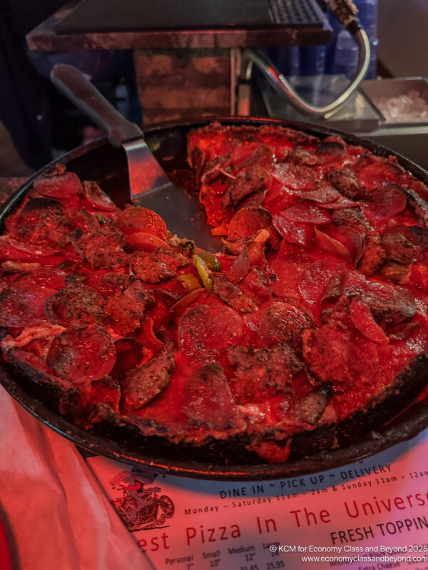 a pizza with a spatula on it