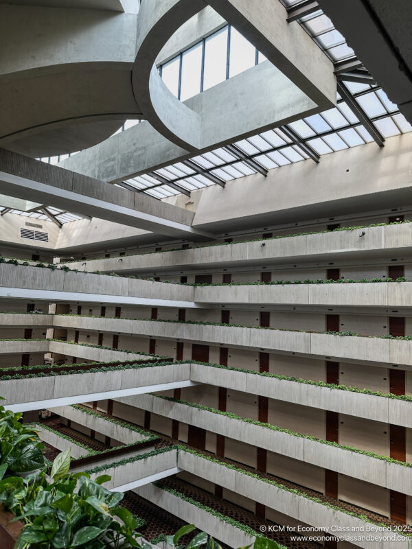 a building with many floors and plants