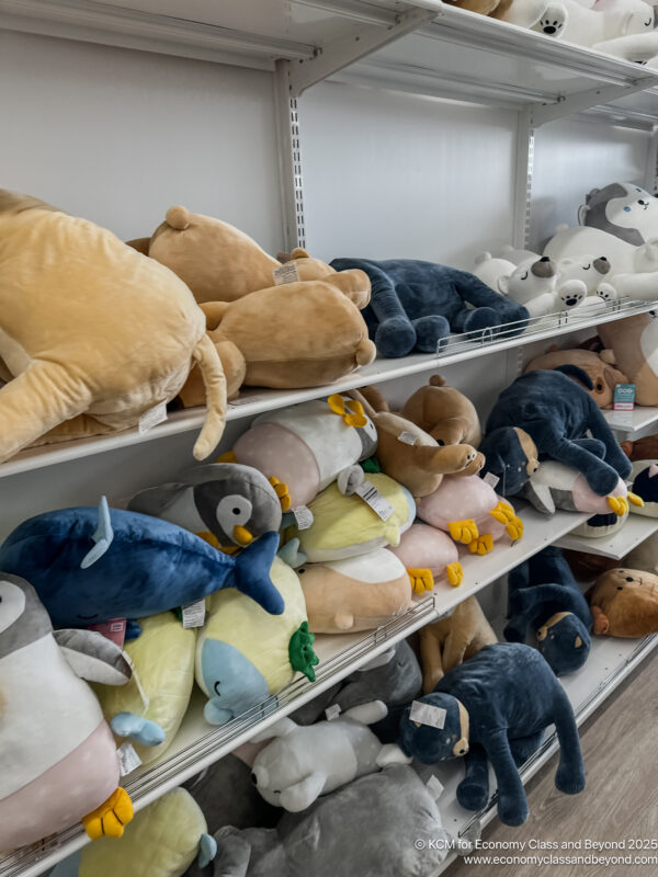 a shelf with stuffed animals