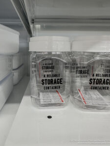 a group of clear plastic containers with white lids