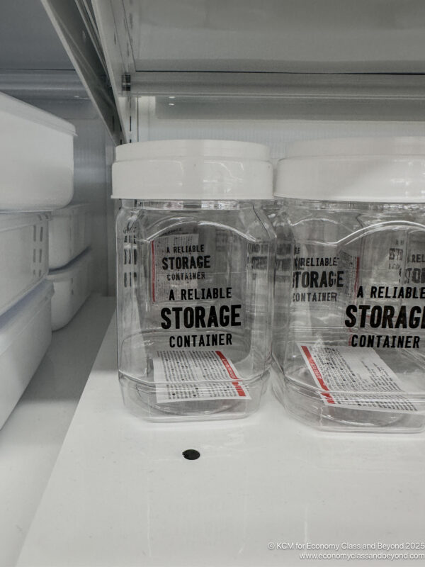 a group of clear plastic containers with white lids
