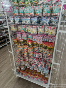 a shelf with toys in plastic wrap