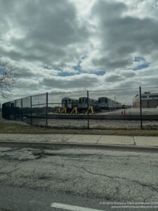 a fence around a train track