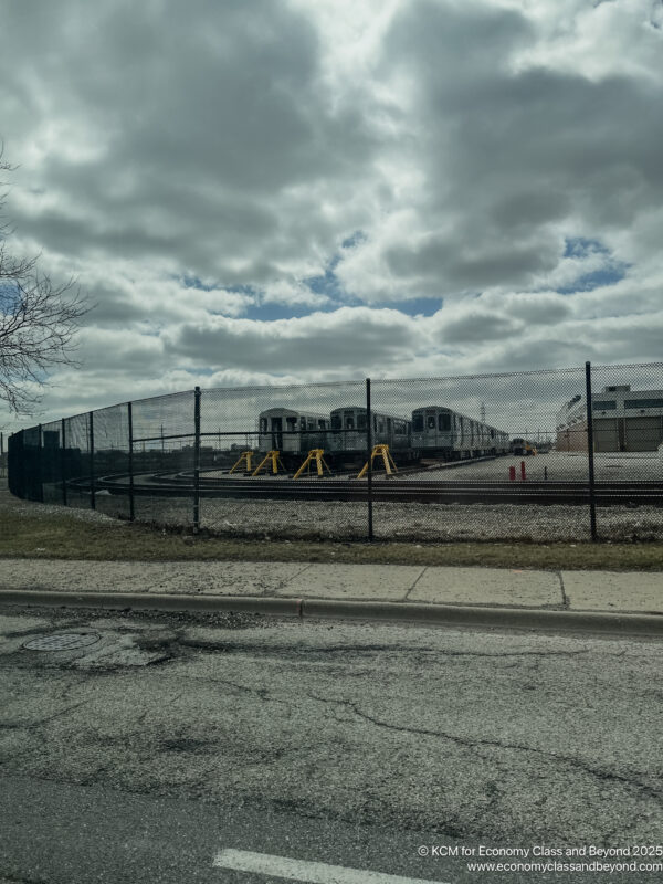 a fence around a train track