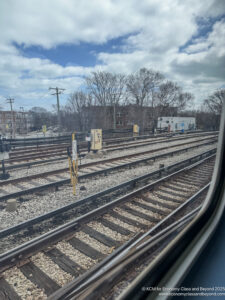 train tracks with a view of trees and buildings