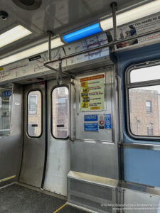 a subway car with a sign on the door