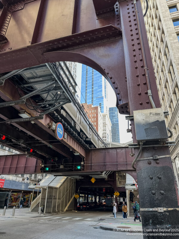 a train tracks under a bridge