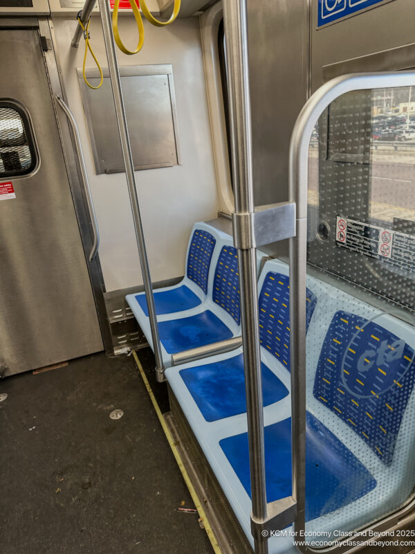 a blue and white seats on a train